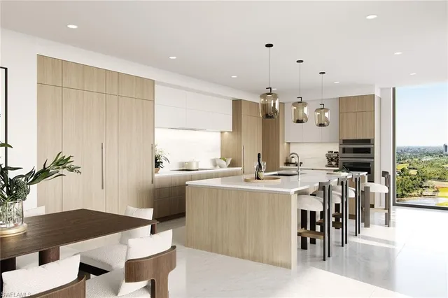 a kitchen with kitchen island a table and chairs in it