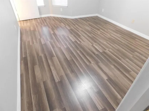 a view of backyard with white wooden floor