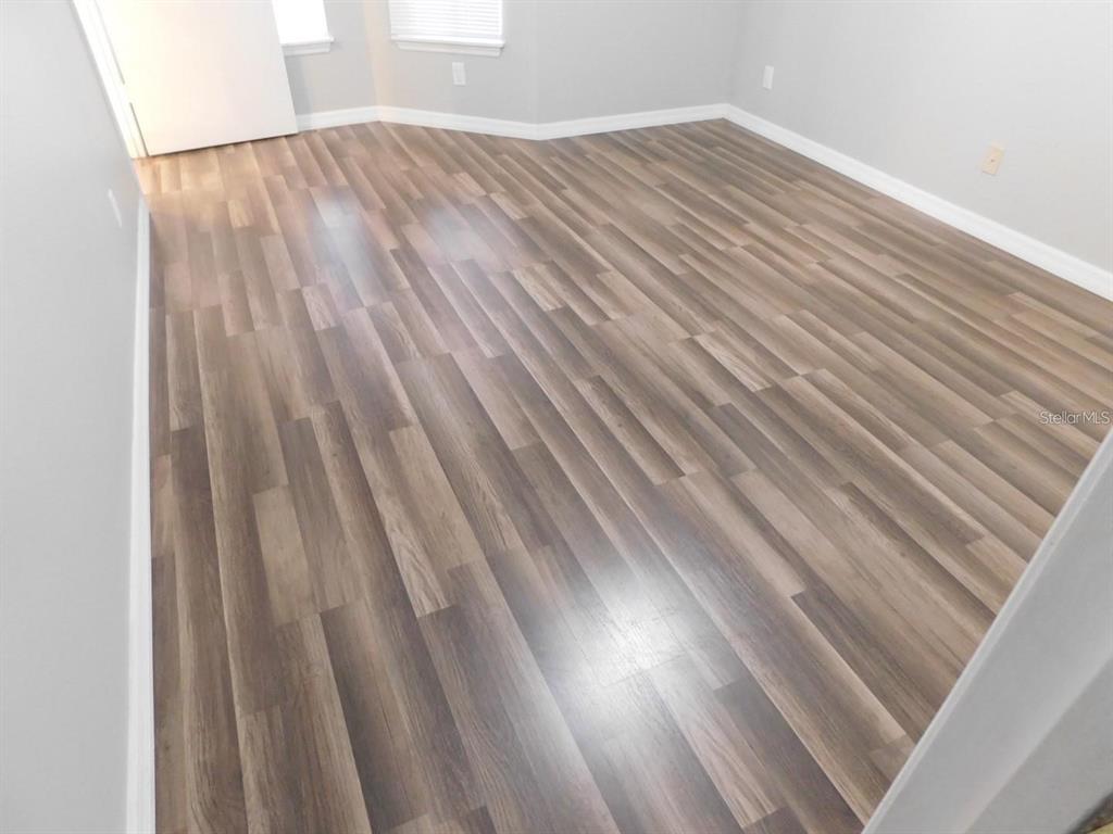 1077 South Hiawassee Road, Unit 823 Orlando, FL 32835 - Photo 16 of 29 a view of backyard with white wooden floor