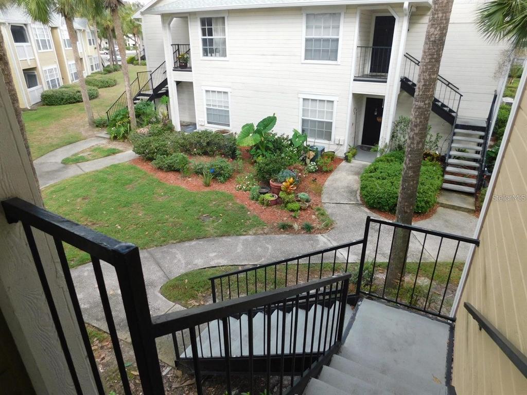 1077 South Hiawassee Road, Unit 823 Orlando, FL 32835 - Photo 2 of 29 a view of a porch with wooden floor and fence