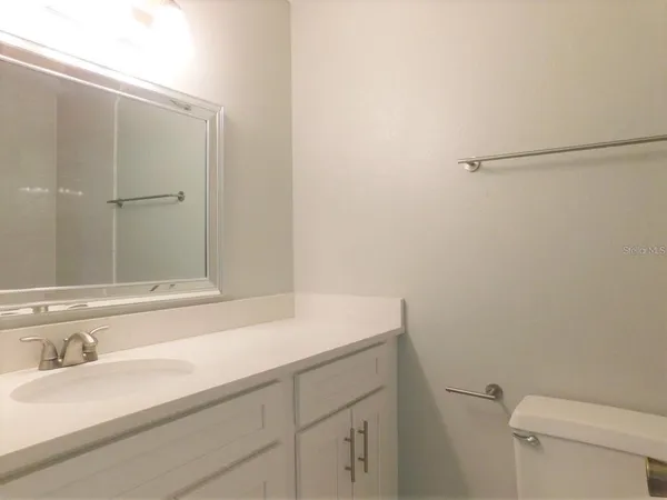 a bathroom with a sink and a toilet