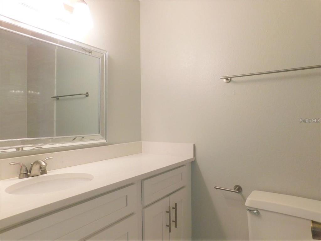 1077 South Hiawassee Road, Unit 823 Orlando, FL 32835 - Photo 24 of 29 a bathroom with a sink and a toilet