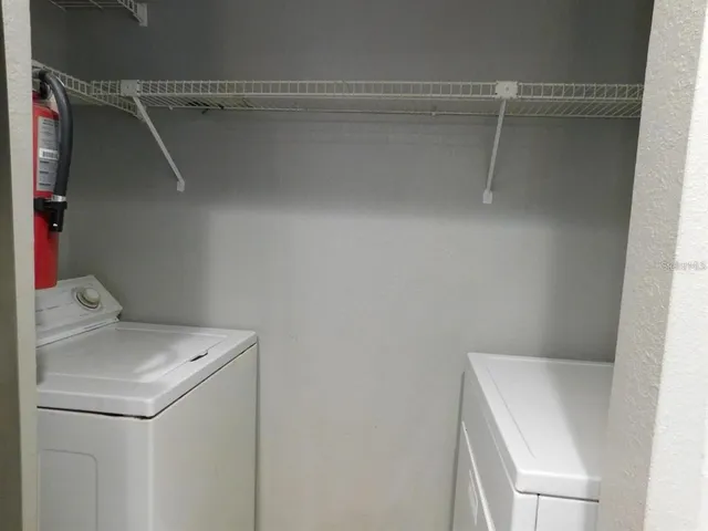 a utility room with dryer and washer