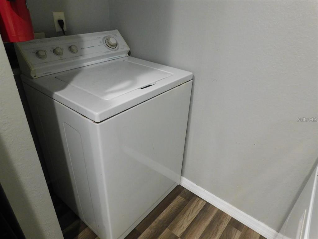 1077 South Hiawassee Road, Unit 823 Orlando, FL 32835 - Photo 27 of 29 a utility room with dryer and washer