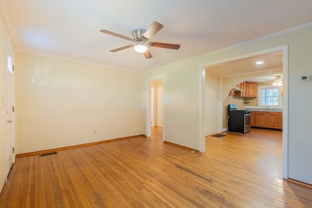 a view of a livingroom with a dishwasher and cabinets