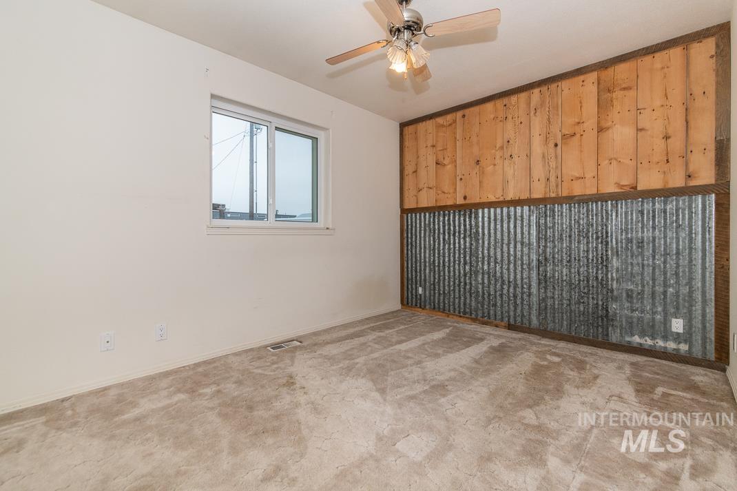 16517 Madison Road Nampa, ID 83687 - Photo 18 of 26 Empty room with a ceiling fan