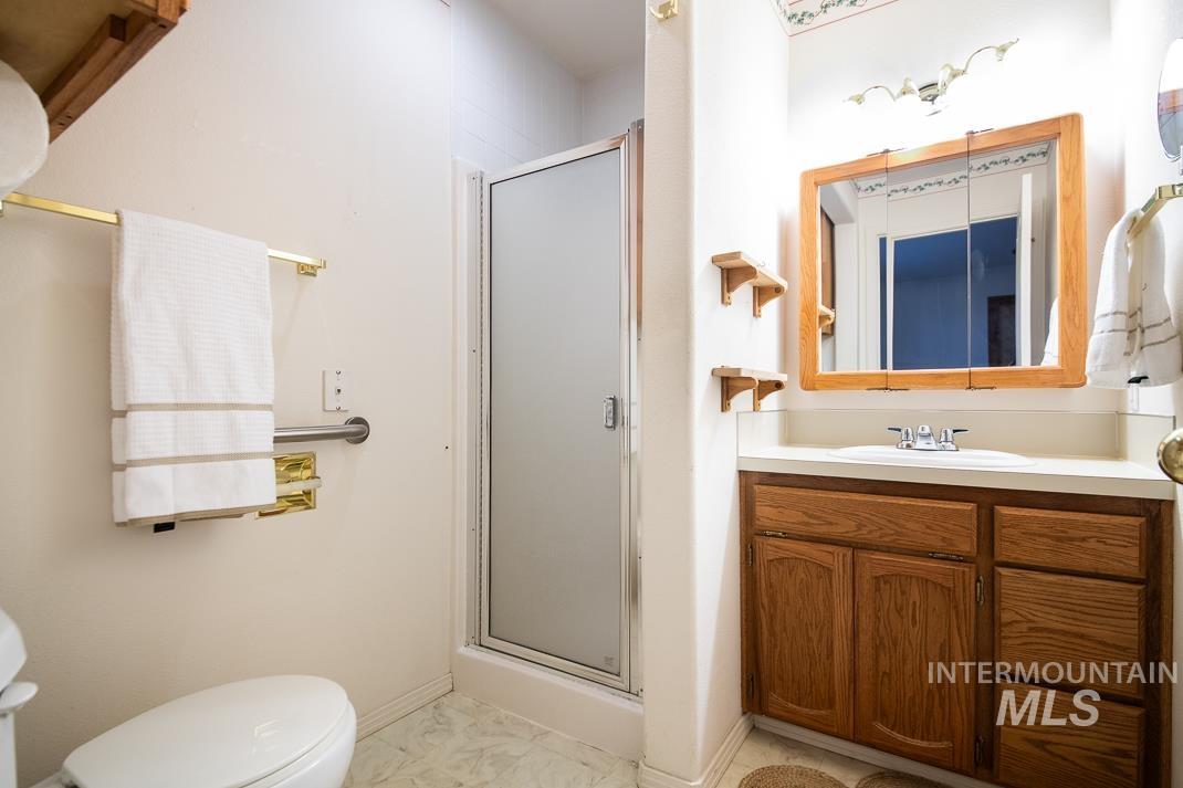 16517 Madison Road Nampa, ID 83687 - Photo 21 of 26 Bathroom with vanity and a shower stall