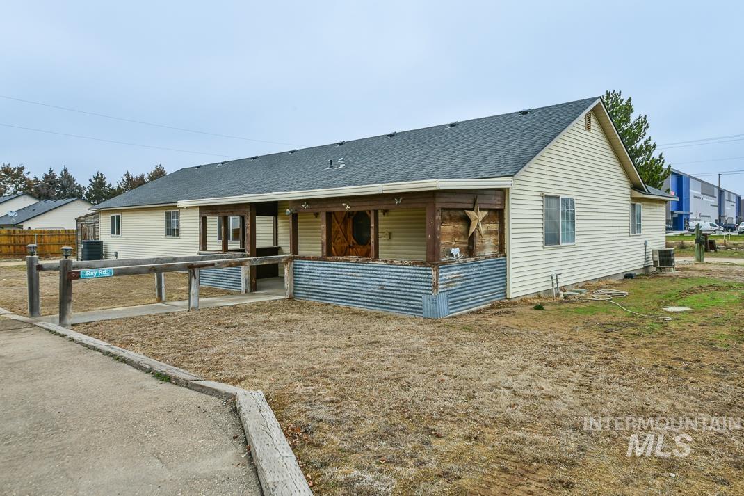 16517 Madison Road Nampa, ID 83687 - Photo 22 of 26 View of front of property featuring roof with shingles, a patio area, and an exterior structure