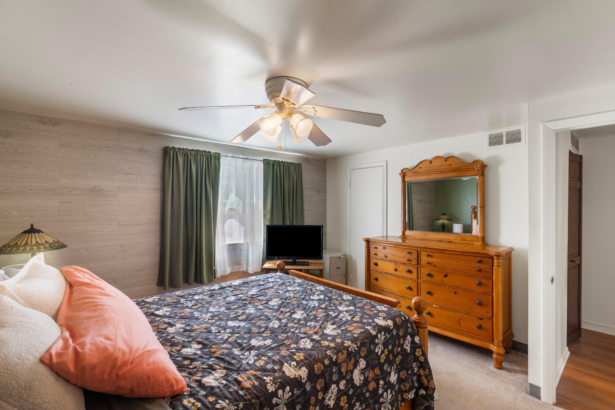 5620 Chelwynd Road Halethorpe, MD 21227 - Photo 12 of 22 a bedroom with a bed and a chandelier