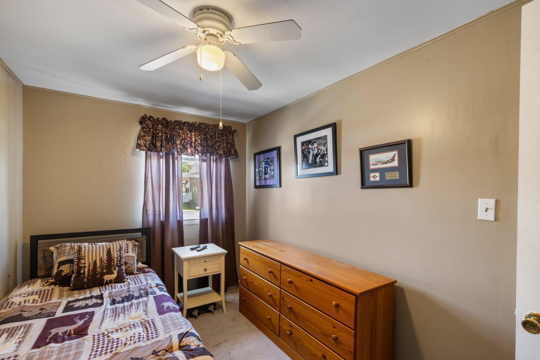 5620 Chelwynd Road Halethorpe, MD 21227 - Photo 16 of 22 a room with furniture and a chandelier