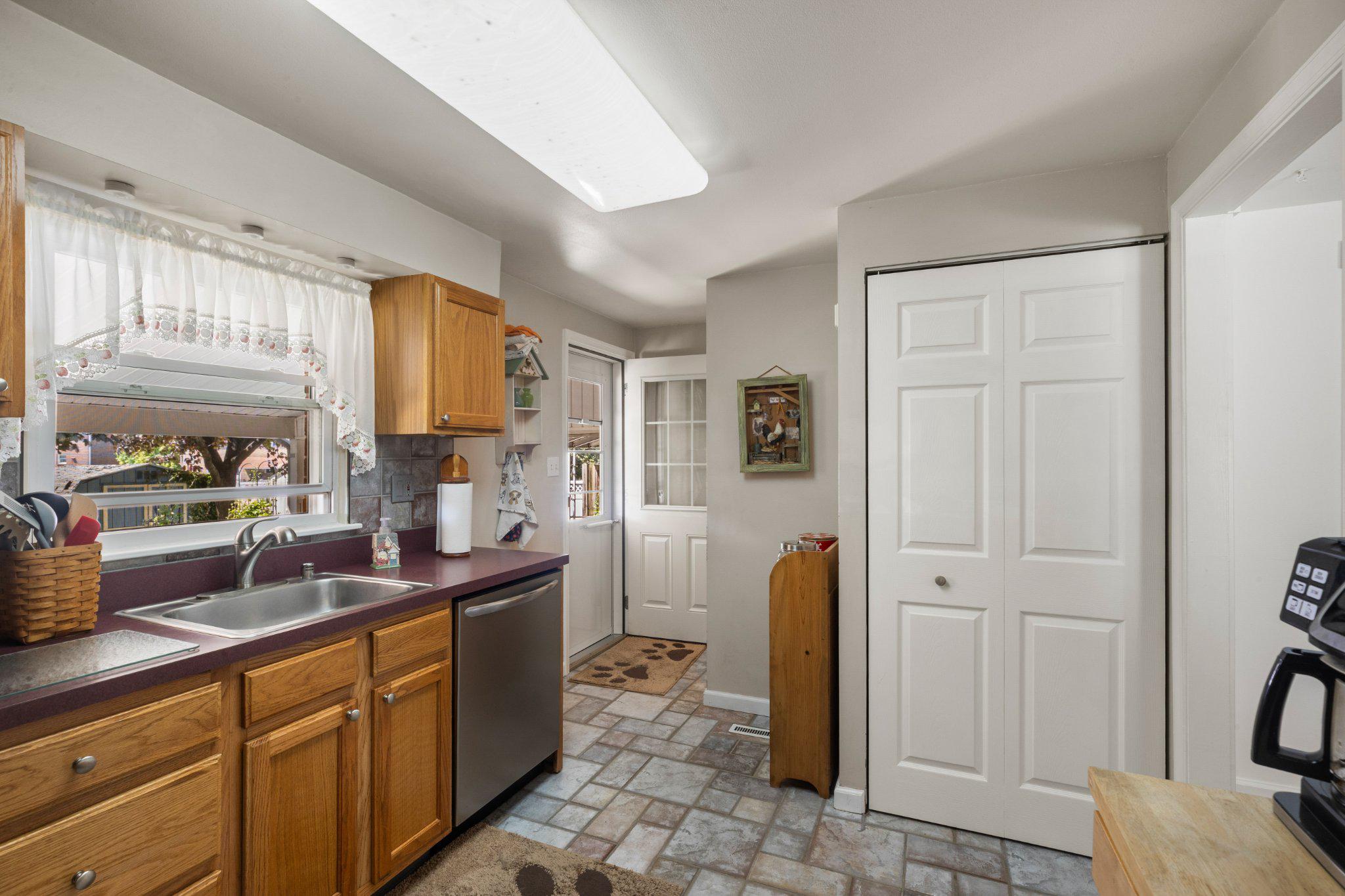 5620 Chelwynd Road Halethorpe, MD 21227 - Photo 7 of 22 a kitchen with stainless steel appliances granite countertop a refrigerator and a sink