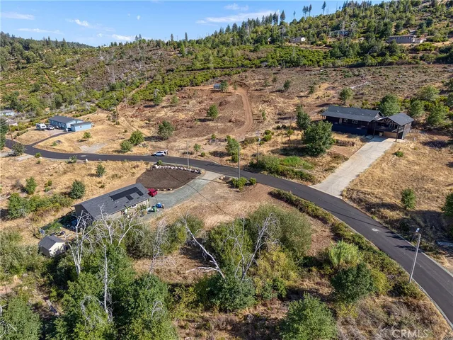 an aerial view of residential houses and outdoor space