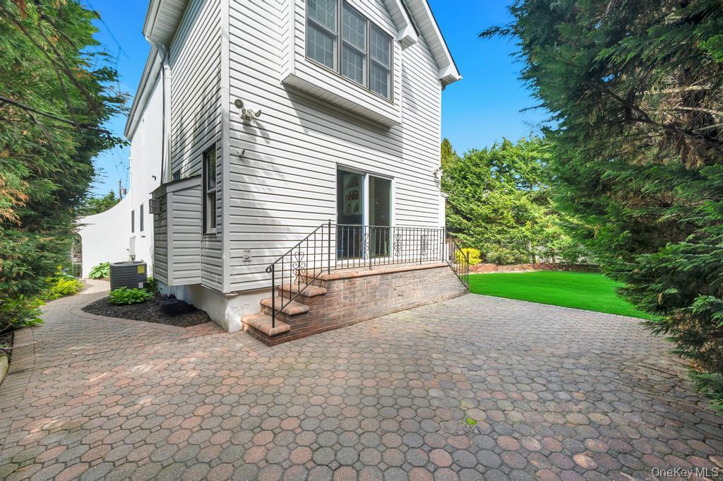 357 Wynsum Avenue Merrick, NY 11566 - Photo 36 of 40 a view of a house with backyard and trees
