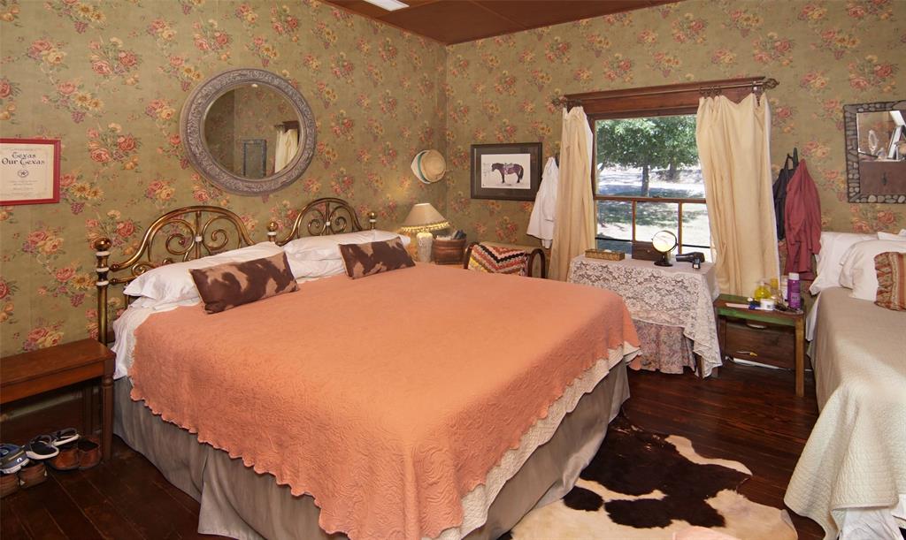 400 Weldons Way Graford, TX 76449 - Photo 19 of 35 a bed sitting in a bedroom next to a window