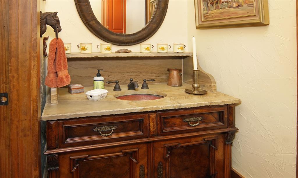 400 Weldons Way Graford, TX 76449 - Photo 22 of 35 a bathroom with a stove and a mirror