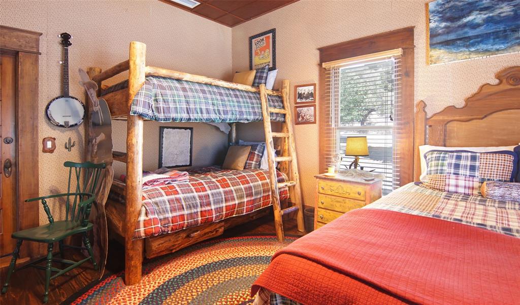 400 Weldons Way Graford, TX 76449 - Photo 24 of 35 a bedroom with two beds and a large window