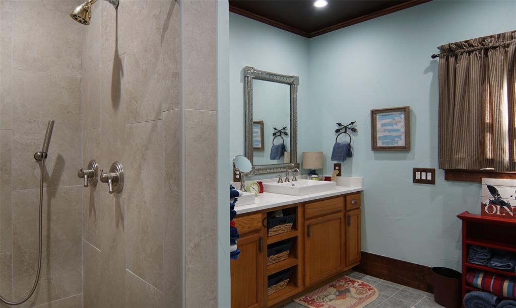 400 Weldons Way Graford, TX 76449 - Photo 27 of 35 a bathroom with a sink and a mirror