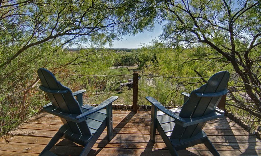 400 Weldons Way Graford, TX 76449 - Photo 28 of 35 a view of a chairs and table on the deck