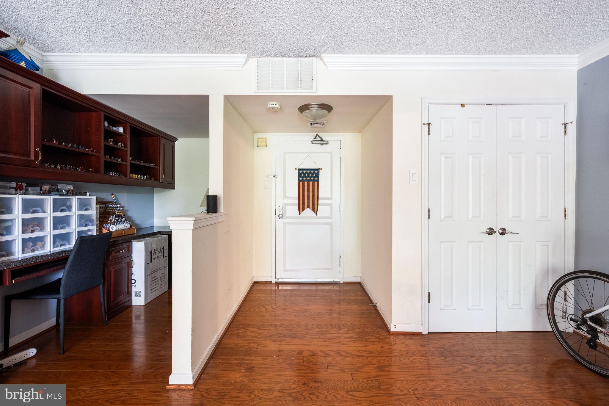 1515 South Arlington Ridge Road, Unit 303 Arlington, VA 22202 - Photo 11 of 34 a view of a hallway with wooden floor and entryway