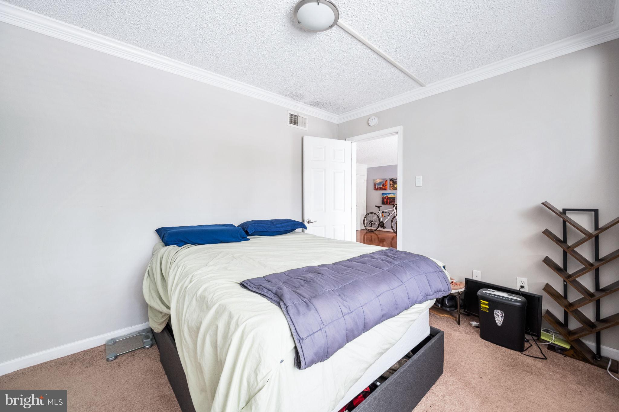 1515 South Arlington Ridge Road, Unit 303 Arlington, VA 22202 - Photo 13 of 34 a bedroom with a bed and a window