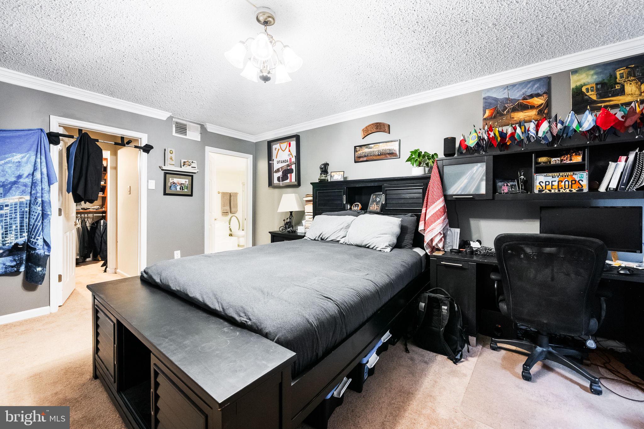 1515 South Arlington Ridge Road, Unit 303 Arlington, VA 22202 - Photo 21 of 34 a bed room with a bed and a tv