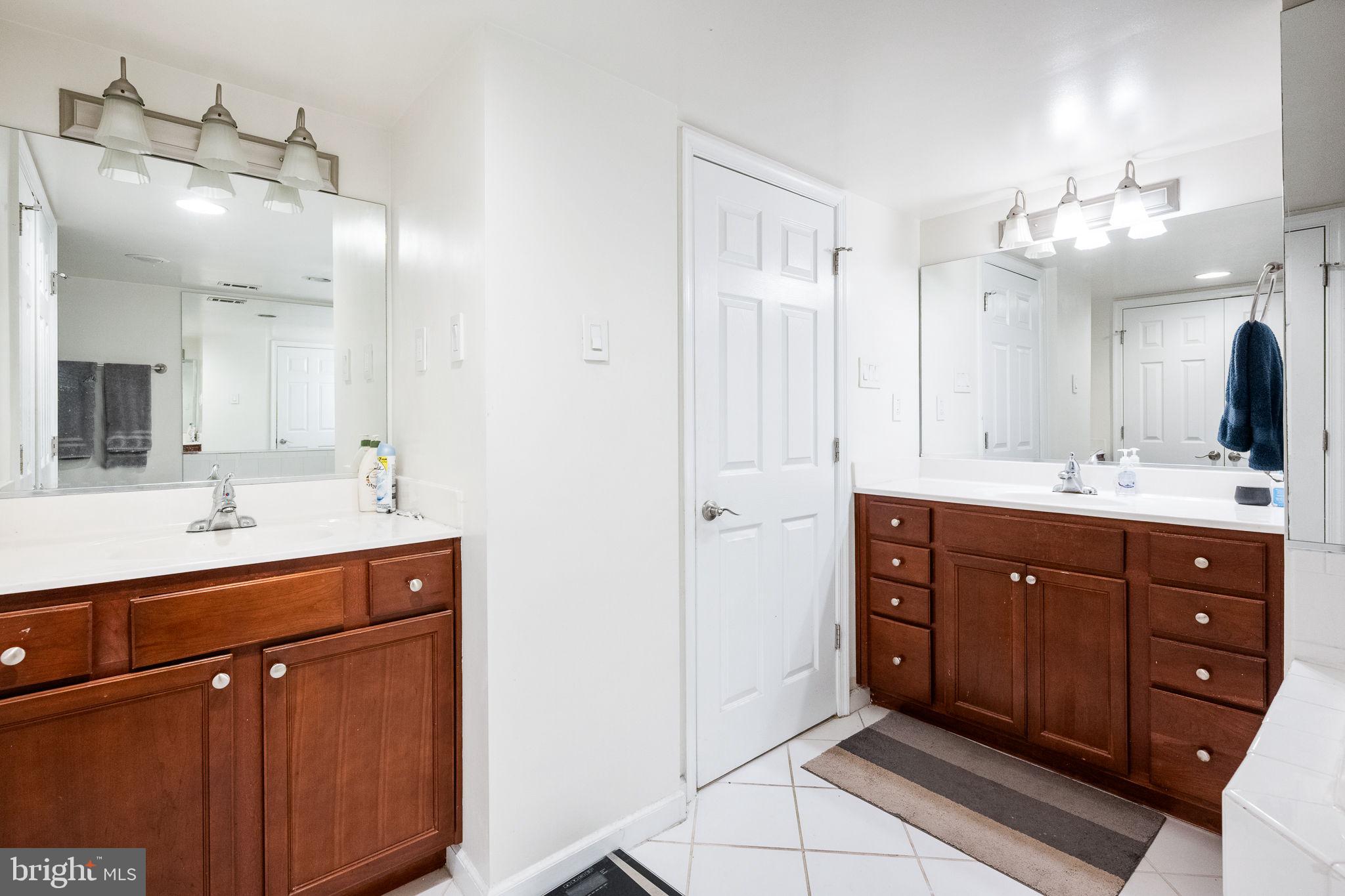 1515 South Arlington Ridge Road, Unit 303 Arlington, VA 22202 - Photo 24 of 34 a spacious bathroom with a double vanity sink mirror and double