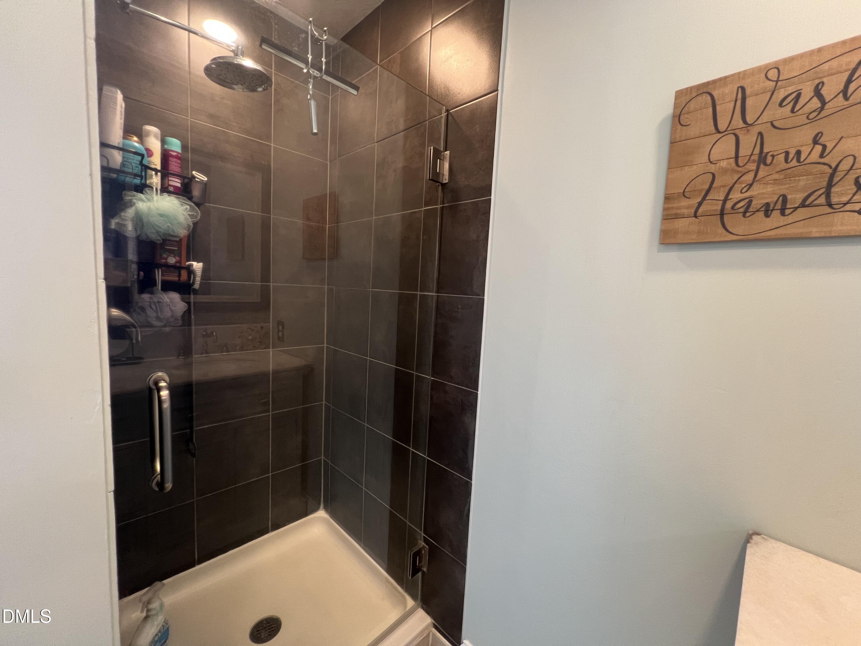 8877 Racine Road Pleasant Garden, NC 27313 - Photo 18 of 45 a bathroom with a shower