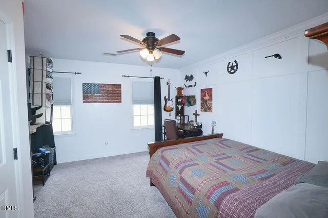 a view of a house with a yard and plants