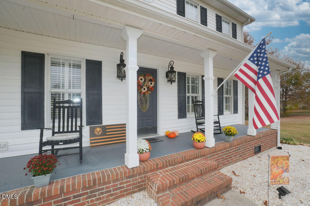 8877 Racine Road Pleasant Garden, NC 27313 - Photo 2 of 45 a front view of a house with a patio