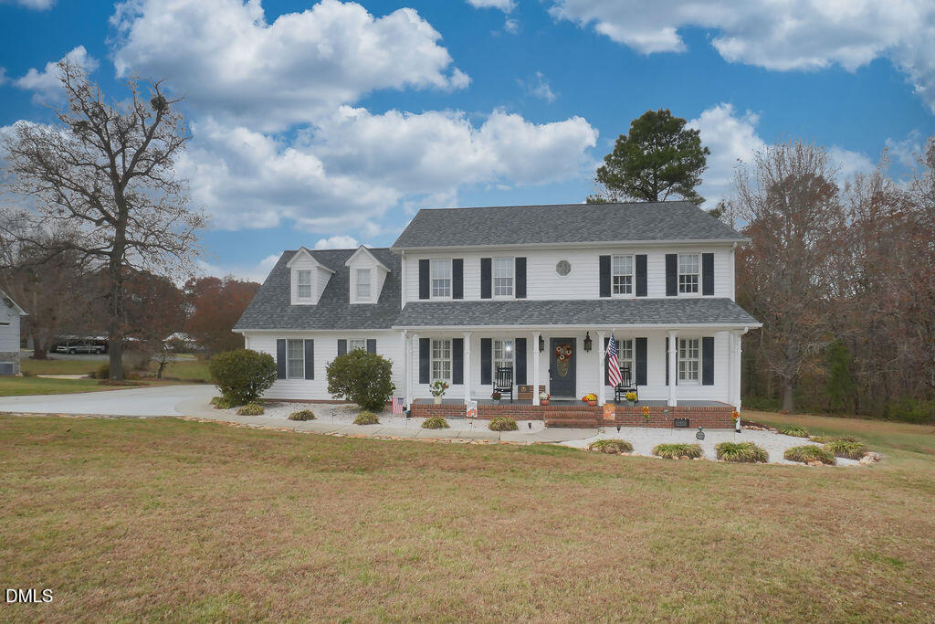 8877 Racine Road Pleasant Garden, NC 27313 - Photo 26 of 45 a front view of a house with a yard