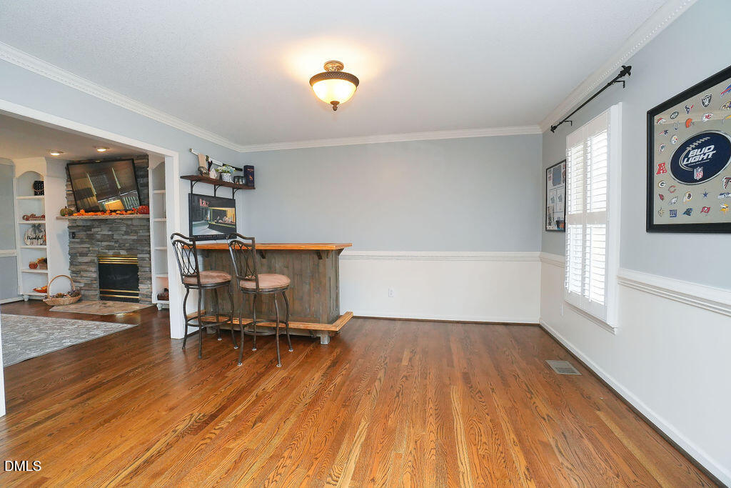 8877 Racine Road Pleasant Garden, NC 27313 - Photo 3 of 45 a view of a workspace with furniture and a window
