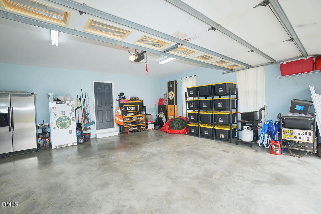 8877 Racine Road Pleasant Garden, NC 27313 - Photo 39 of 45 a view of a garage with rack and bicycle