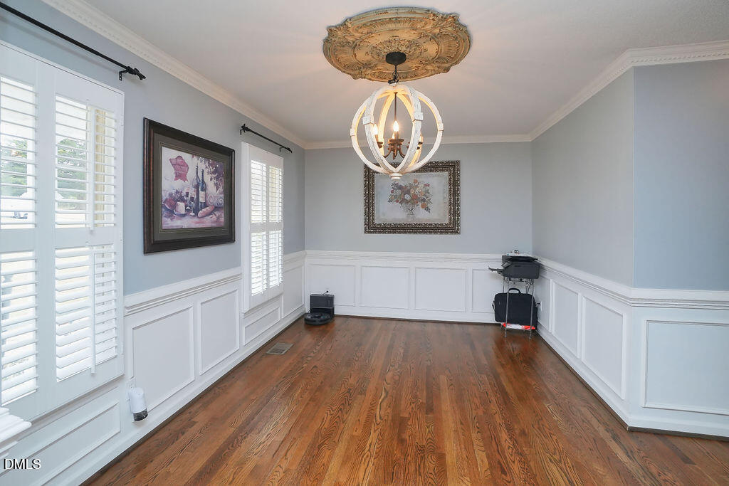 8877 Racine Road Pleasant Garden, NC 27313 - Photo 5 of 45 a view of empty room with wooden floor and window