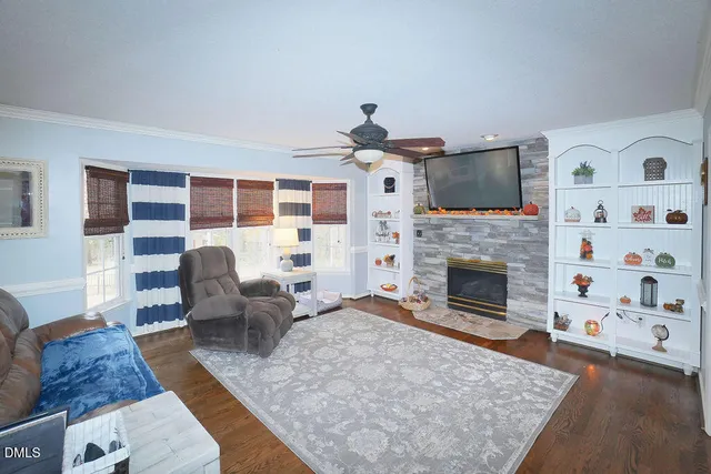 a kitchen with stainless steel appliances granite countertop a refrigerator a stove top oven a sink and dishwasher