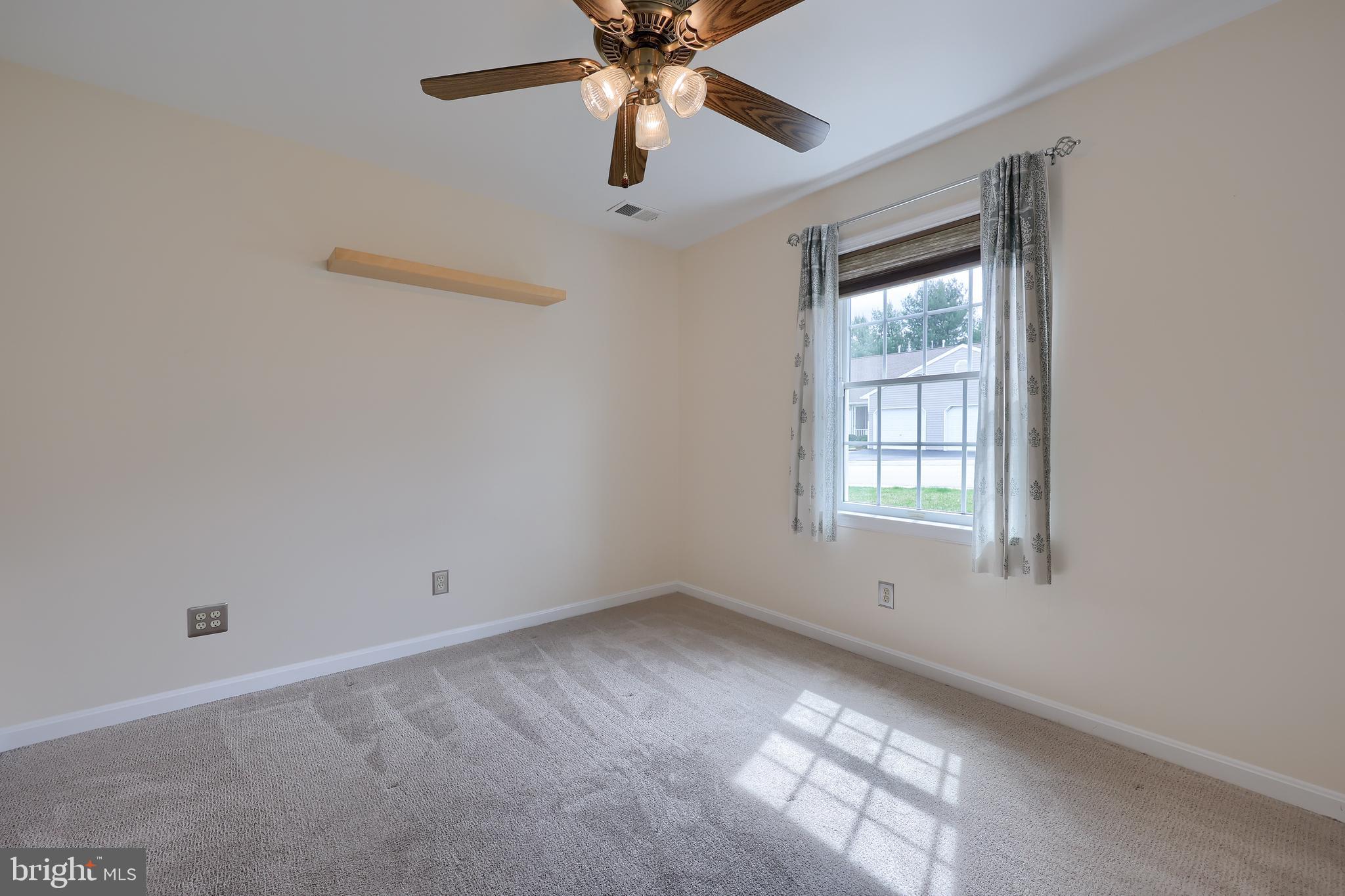 2002 Faversham Way York, PA 17402 - Photo 29 of 37 an empty room with windows and fan