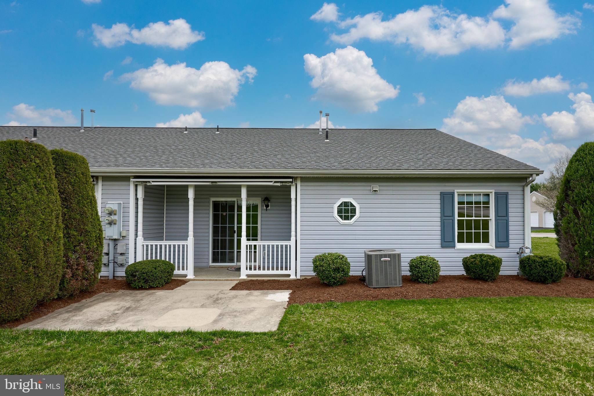 2002 Faversham Way York, PA 17402 - Photo 33 of 37 a front view of a house with garden and porch