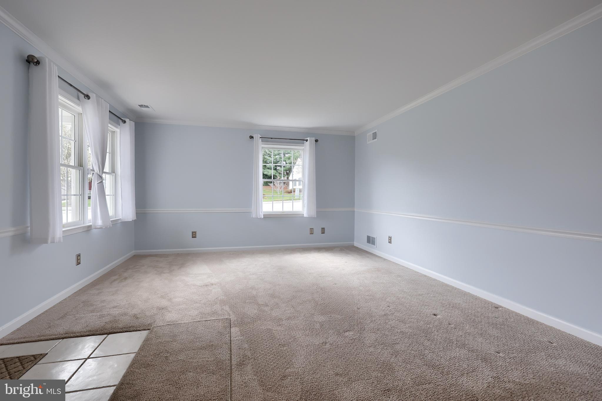 2002 Faversham Way York, PA 17402 - Photo 7 of 37 a view of a big room with windows and chandelier fan
