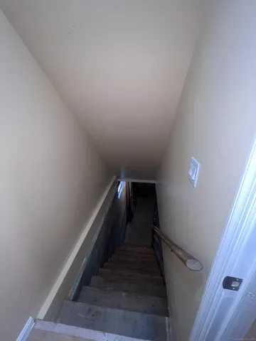 a view of an empty room with wooden walls