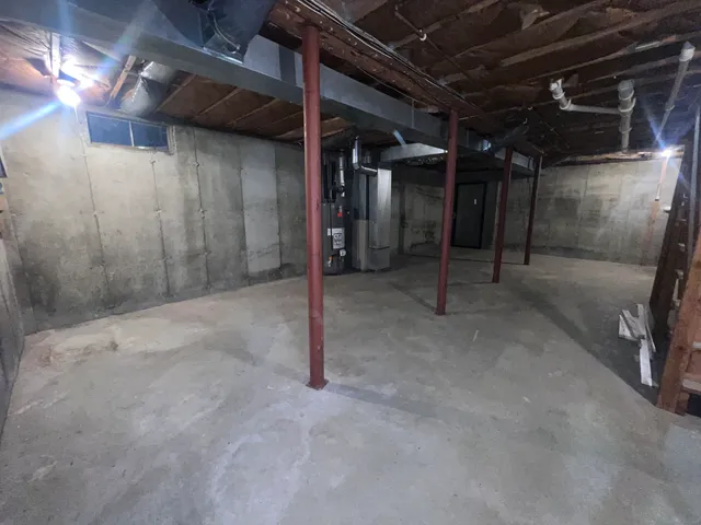 a view of an empty room with wooden roof