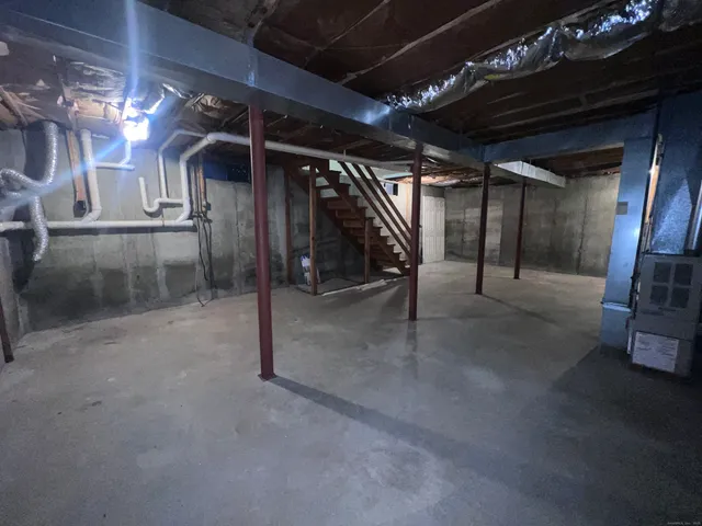 a view of an empty room with a fireplace