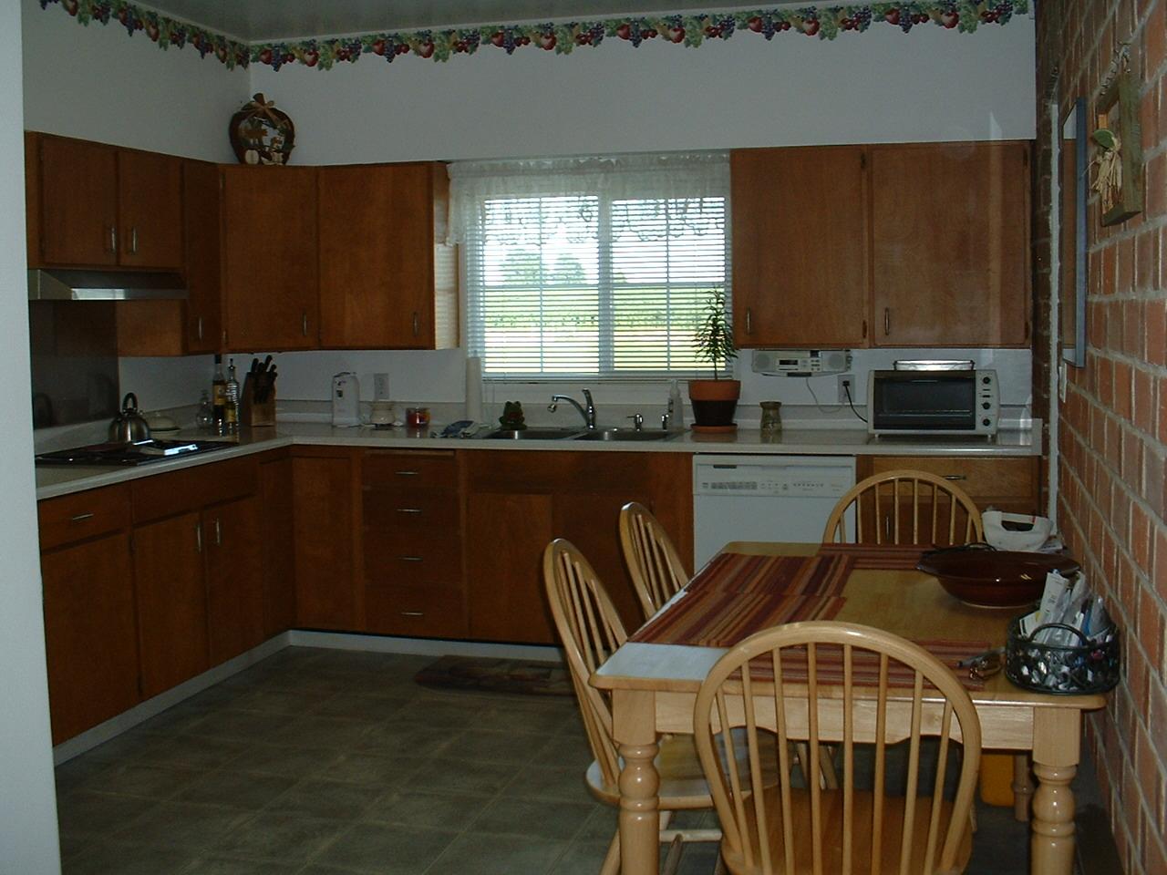 41 Knowles Road Outlook, WA 98938 - Photo 4 of 10 a kitchen with stainless steel appliances a sink a stove cabinets counter space and a window