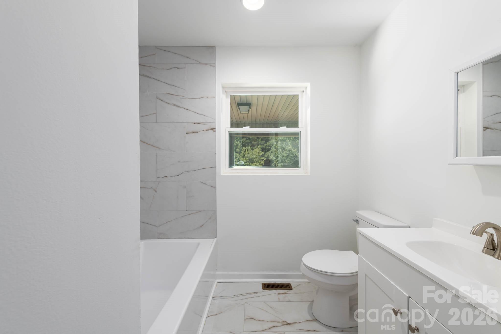 108 South Little Texas Road Kannapolis, NC 28083 - Photo 11 of 18 a bathroom with a toilet a sink and bathtub