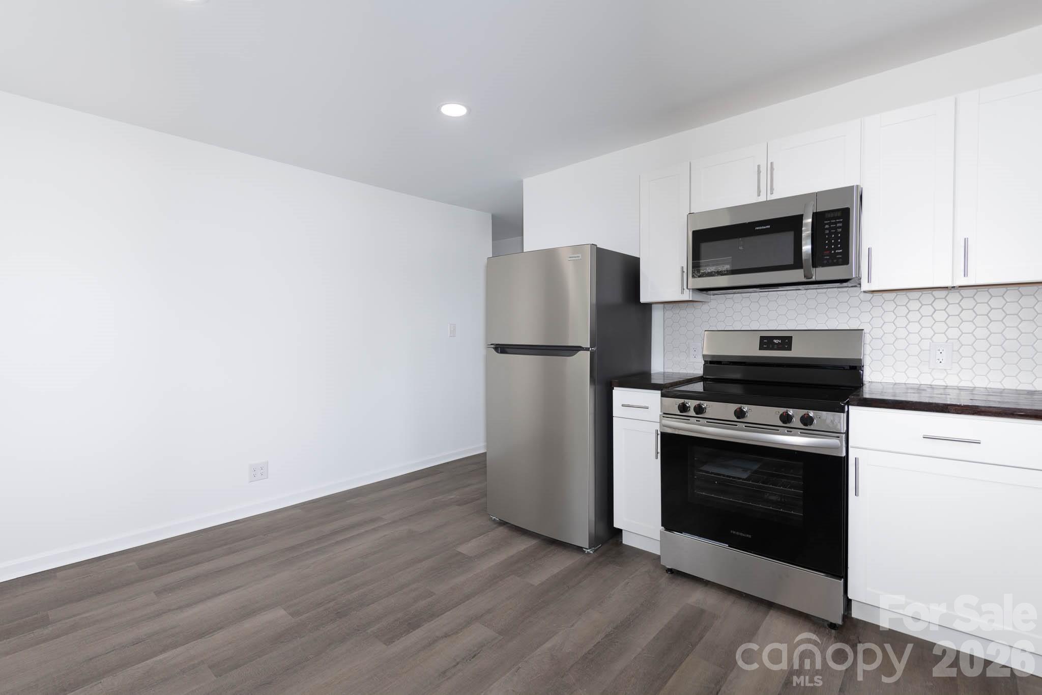 108 South Little Texas Road Kannapolis, NC 28083 - Photo 6 of 18 a kitchen with a refrigerator stove and microwave