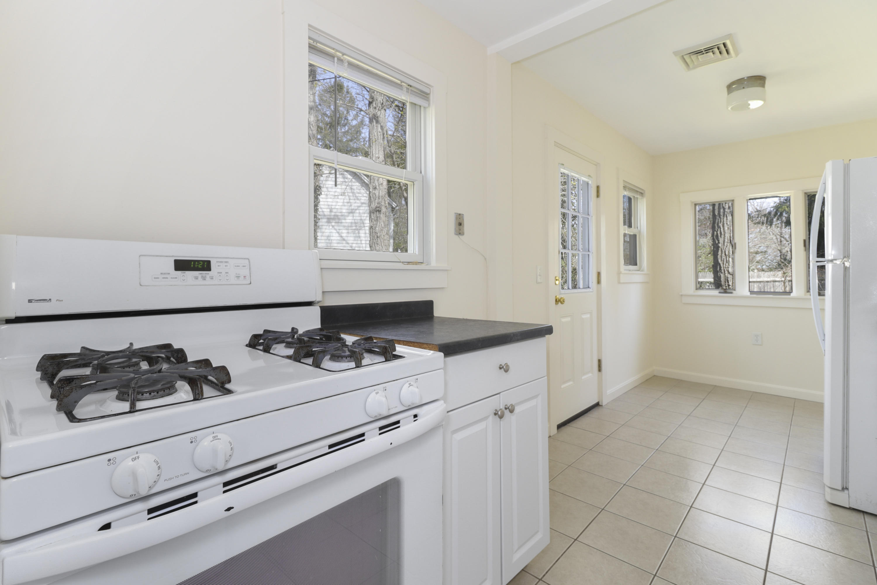 1245 A County Road Cataumet, MA 02534 - Photo 11 of 23 a kitchen with stainless steel appliances a cabinets and stove top oven