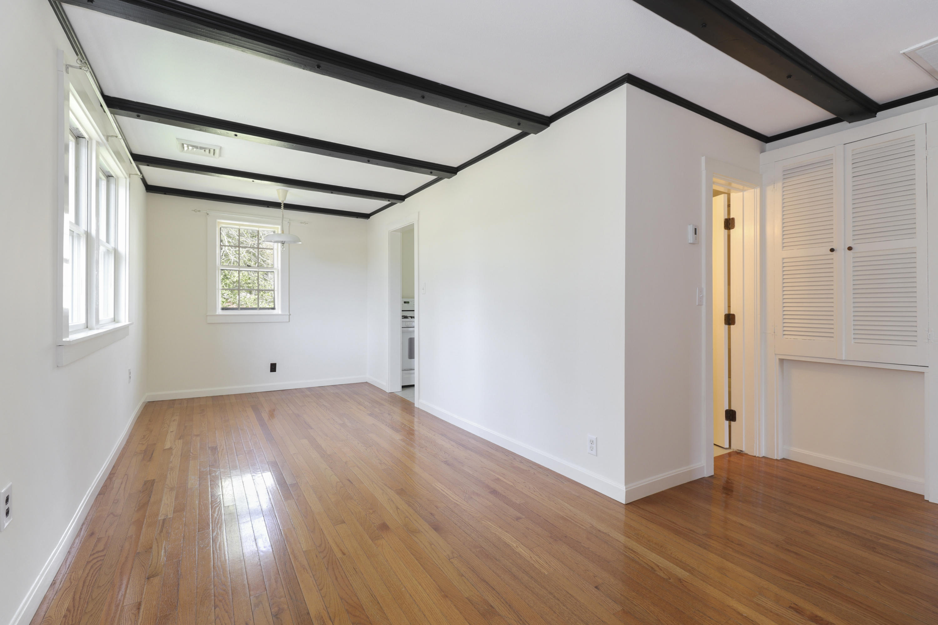 1245 A County Road Cataumet, MA 02534 - Photo 5 of 23 a view of a room with wooden floor and window