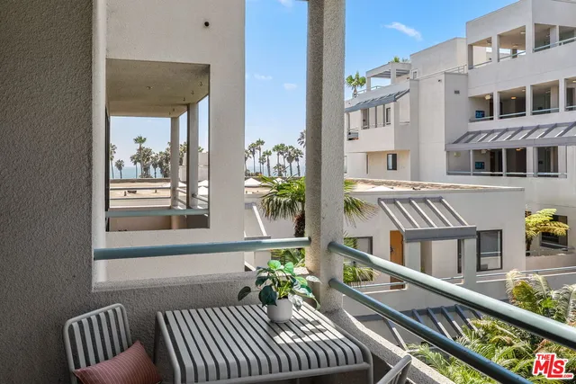 a view of swimming pool from a balcony