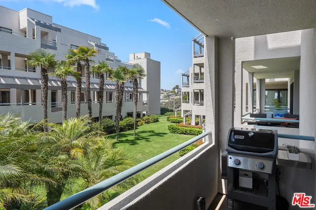 a bed room with a bed and a potted plant