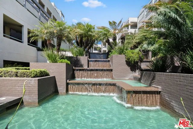 a view of a swimming pool with a lounge chairs