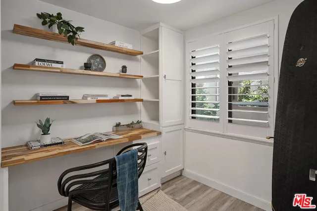 a view of workspace with wooden floor