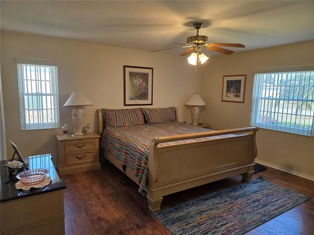 a bedroom with bed and a window